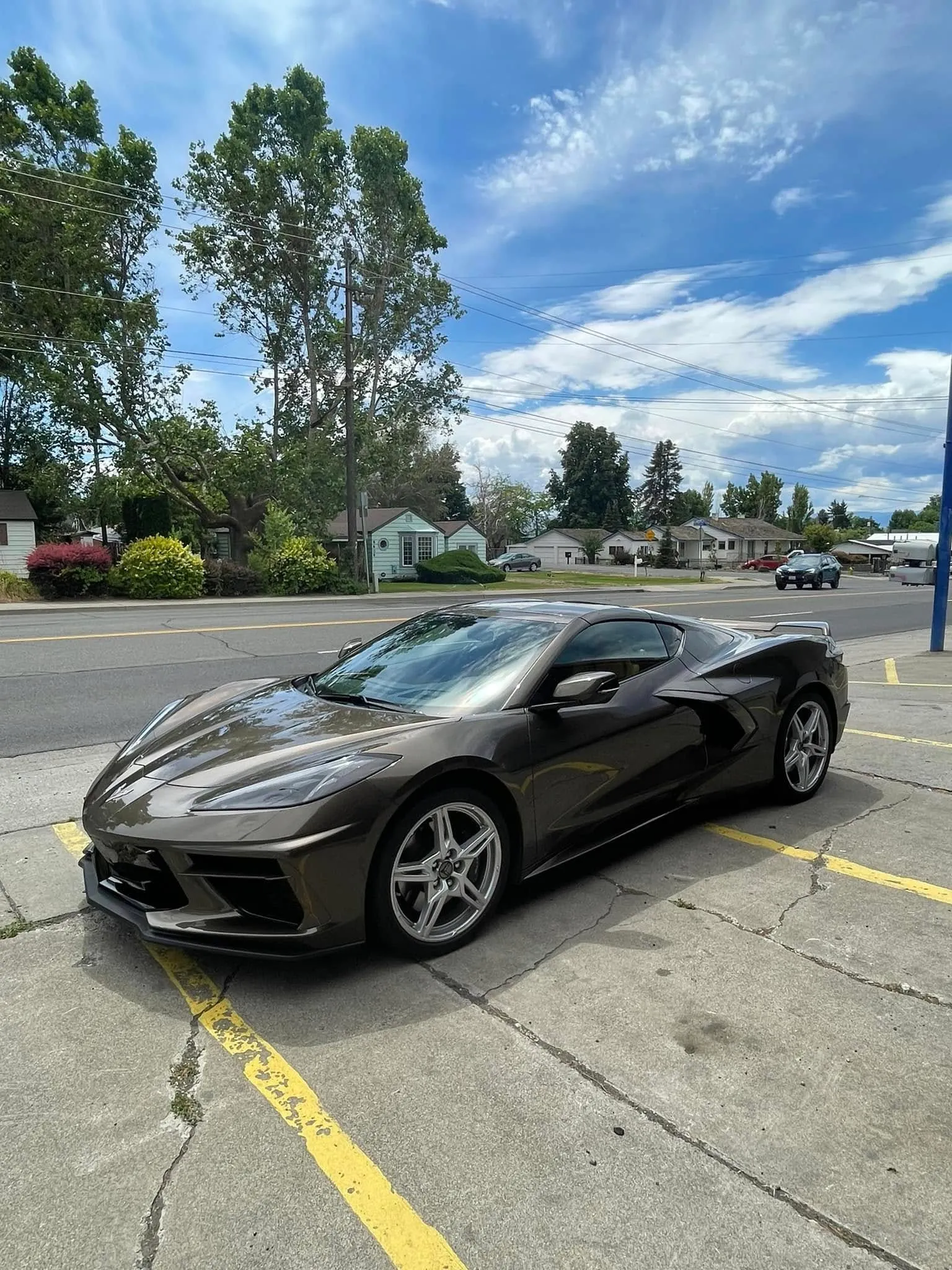 Bronze Chevrolet Corvette C8 with premium ceramic window tint photographed on a sunny Yakima Valley street