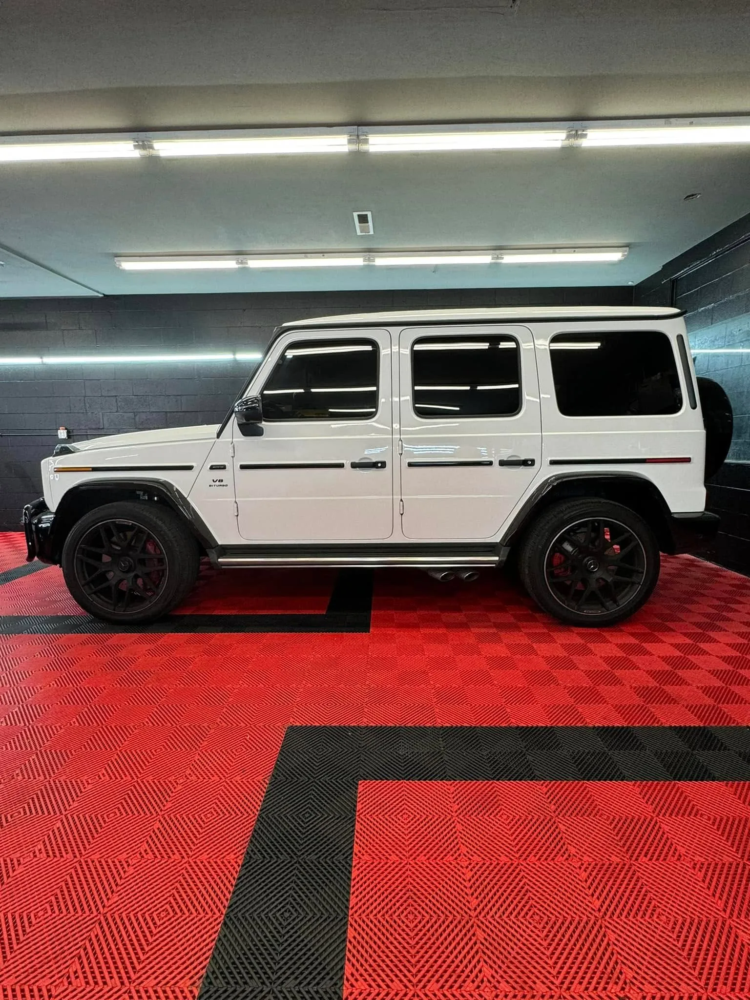White Mercedes-Benz G63 AMG G-Wagon inside the Redline Tinting bay with ceramic window tint installed