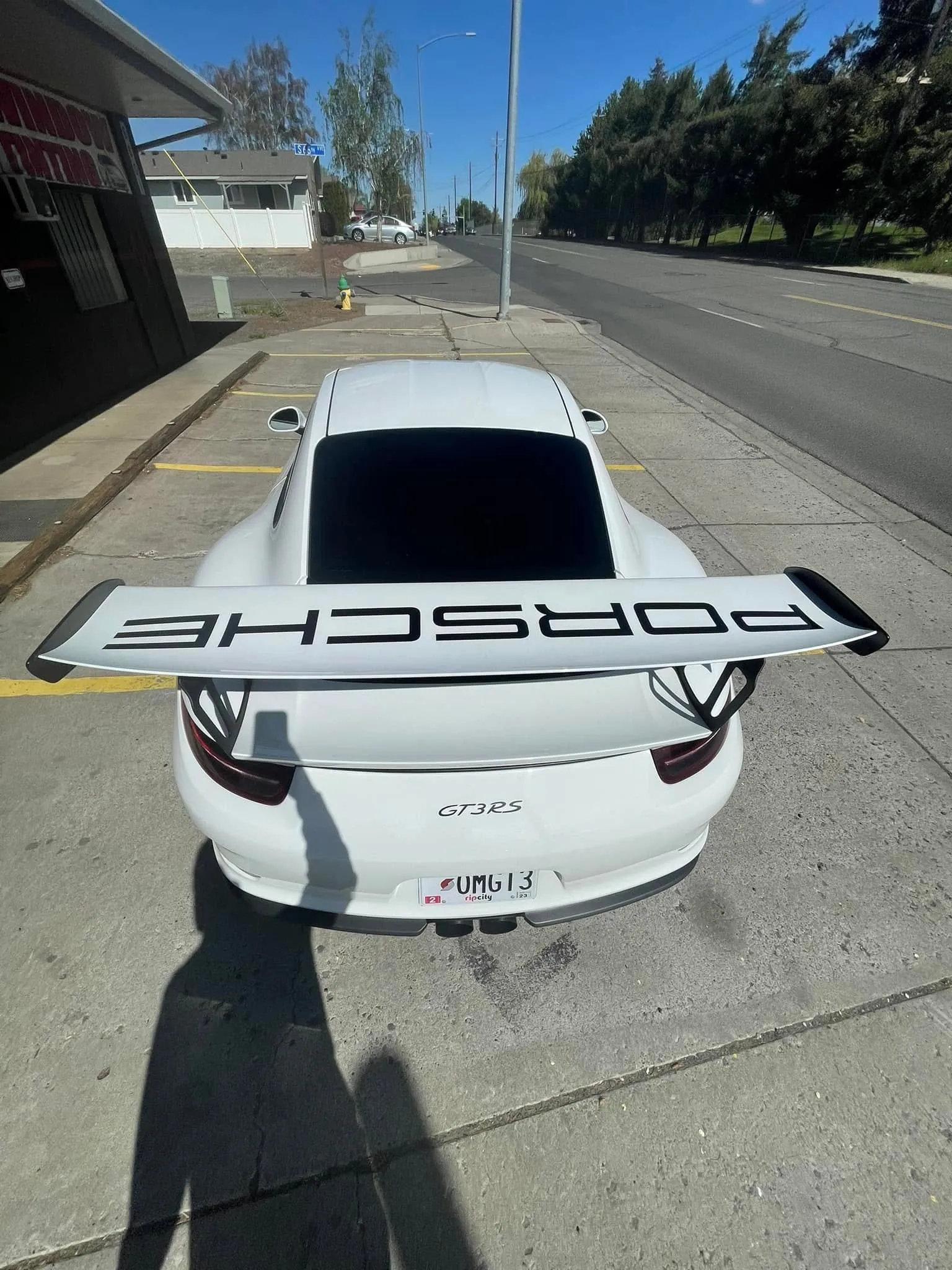 Rear view of a white Porsche 911 GT3 RS showing crisp legal-shade window tint on the rear glass and quarter windows